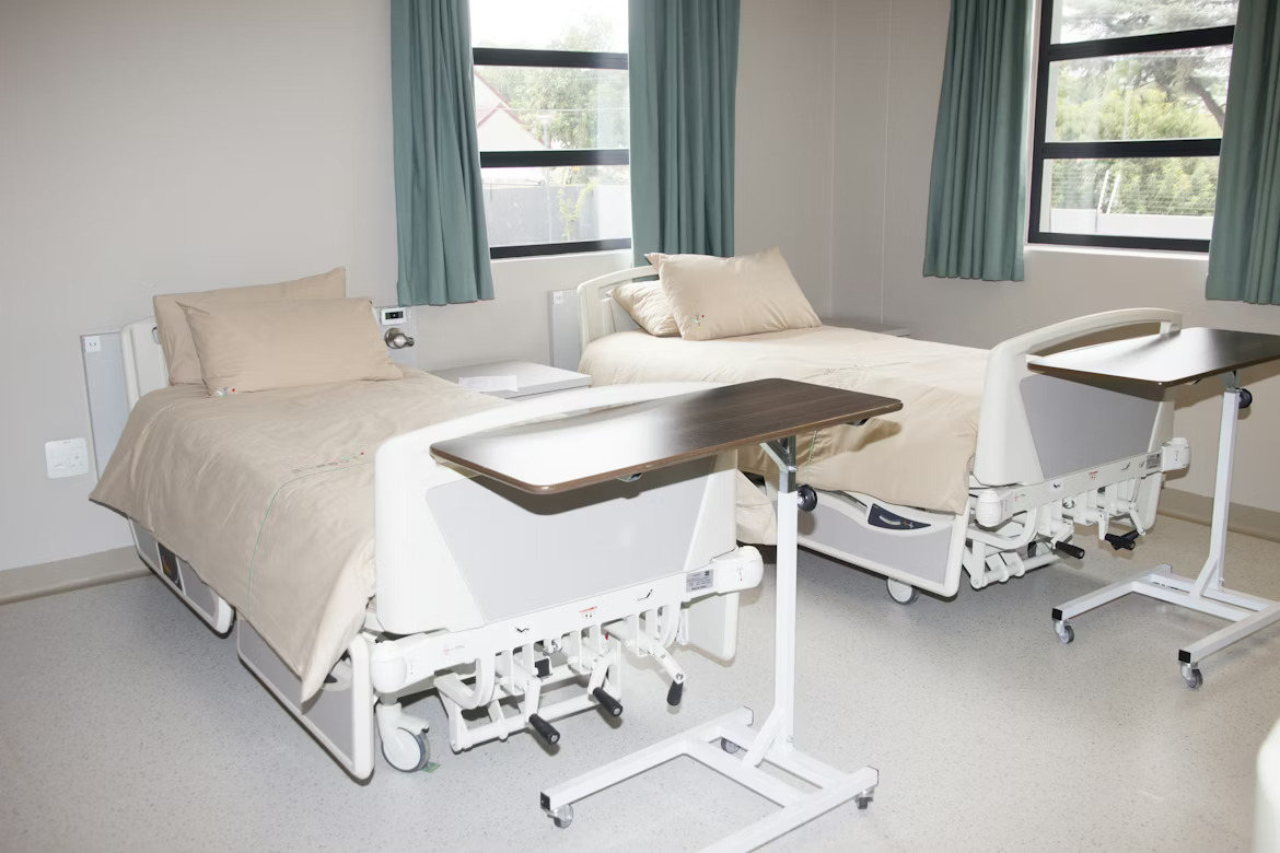 Hospital ward with beds and linen