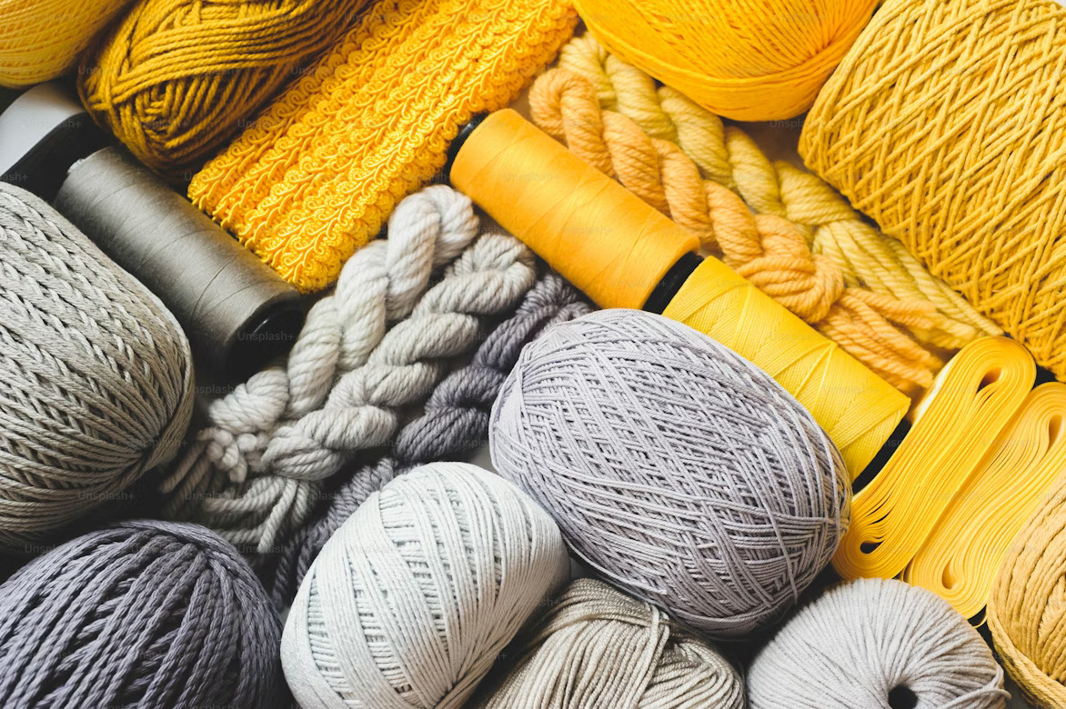 Yellow and grey yarn with threads